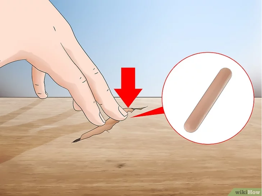 Utilisation d’un bâton de cire pour les petites et moyennes fissures